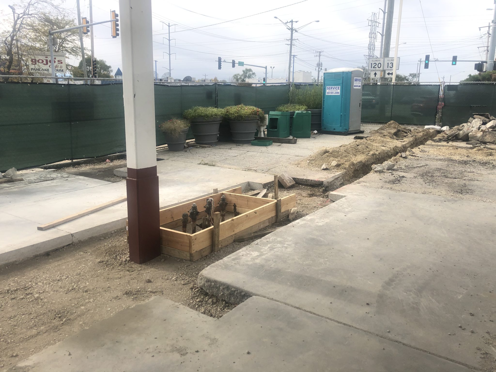 Preparing for concrete work around the gas pumps at the BP station in ...